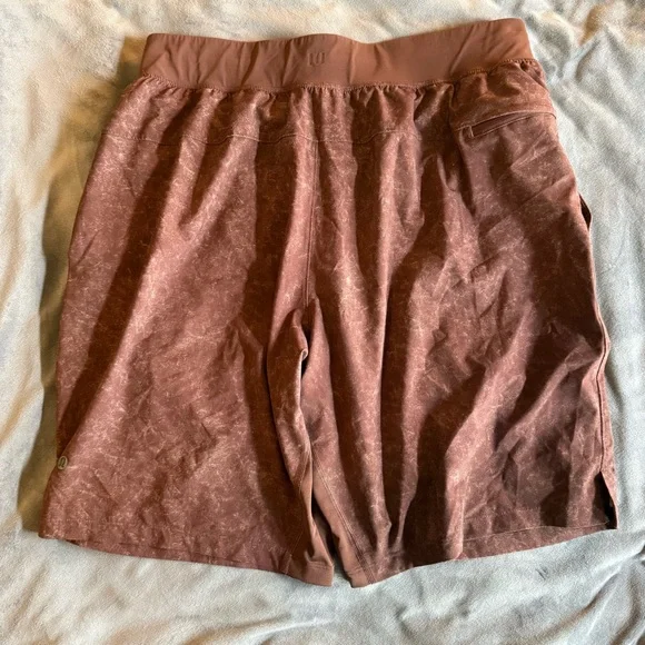 Lululemon Pace Breaker Shorts (7” inseam) in a Washed/Distressed Rust colorway. - Picture 3 of 4
